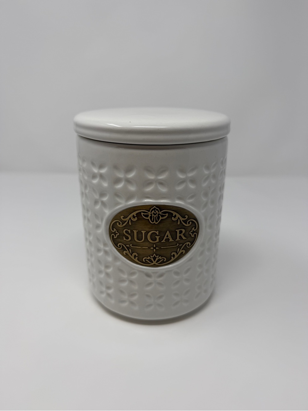 White Ceramic Sugar Canister with Decorative Brass Plaque